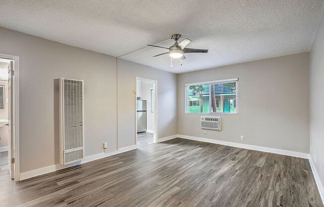 The Island Apartments unfurnished living room and window