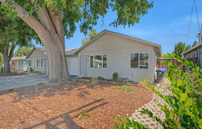Charming 2 Bed 1 Bath Duplex Unit with Beautifully Landscaped Backyard