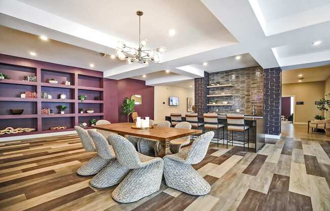 A modern dining room with a wooden table and chairs.