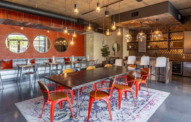 a large dining room with a long table and chairs