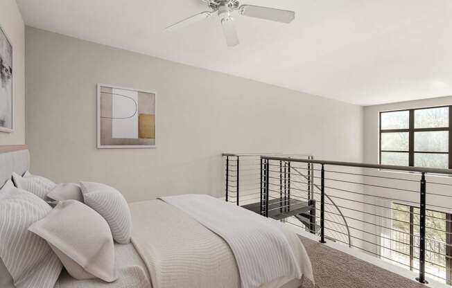 A bedroom with a bed, a ceiling fan, and a balcony.