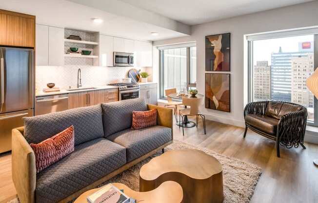 A modern living room with a grey sofa and a wooden coffee table.