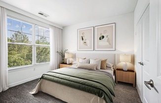 a bedroom with a bed and a large window at Aspire Apollo, Camp Springs, MD