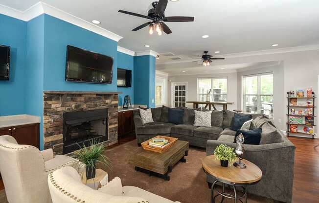 a living room with blue walls and a fireplace