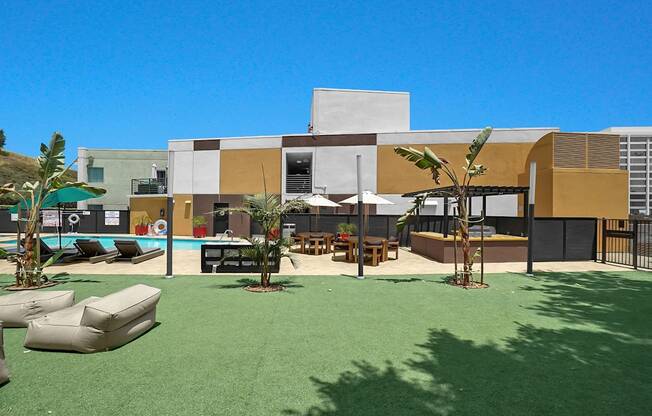 A modern building with a pool in front.