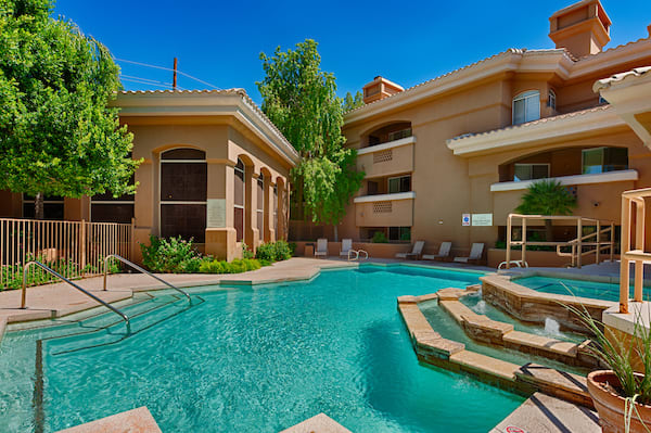 Apartments for Rent Old Town Scottsdale AZ - Cibola - Pool Area with Jacuzzi, Lounge Chairs, and Planters