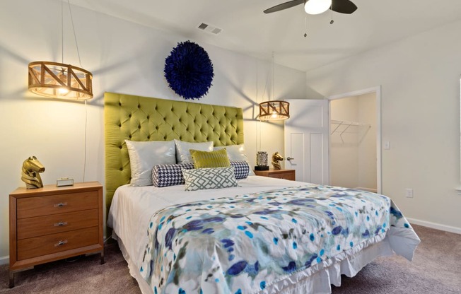 Ashland Farms Large Bedroom with Plush Carpet, Ceiling Fan, and Walk-In Closet.