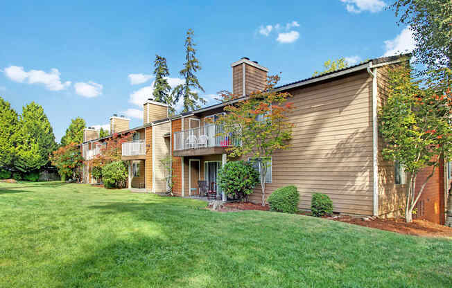A house with a brown siding and a balcony.