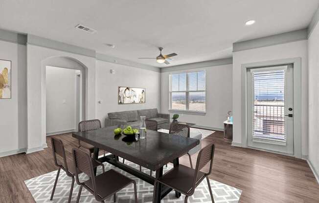 A dining room with a table set for two.