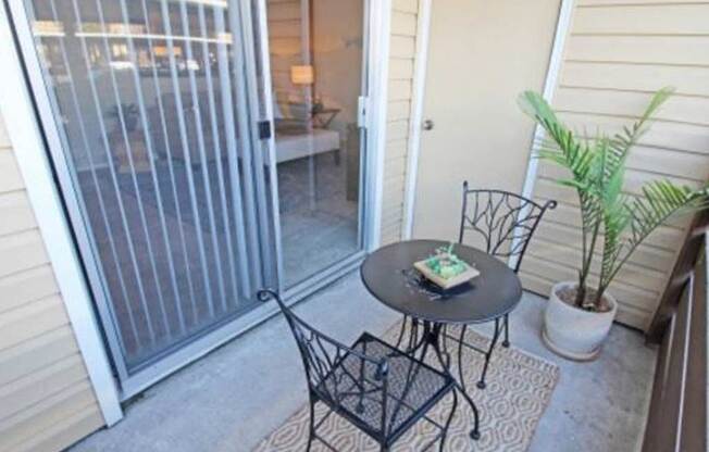 Patio with take and chairs The Palms Apartments for rent in Sacramento CA 
