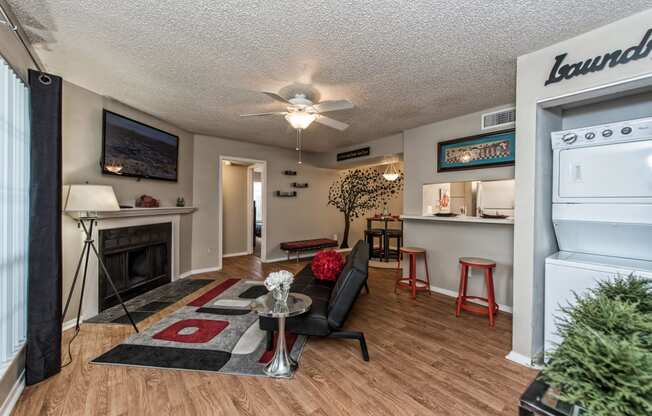 Living Room with Fireplace And TV at Abbey Glenn Apartments, Waco, TX, 76706