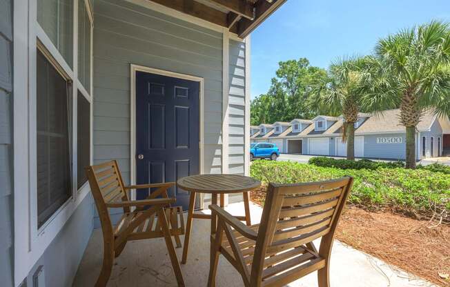 A blue door is on the left side of a house.