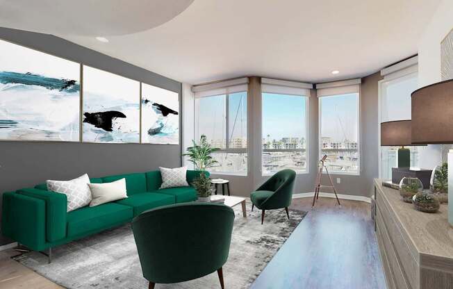 A living room with a green couch and a blue rug at Esprit Marina del Rey, 90292