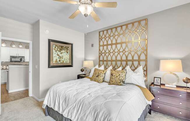 Bedroom with a large bed and a ceiling fan at Sterling Creek at Richmond Hill, Richmond Hill, GA, Georgia 