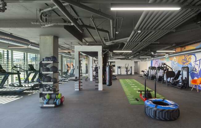 Woodland Hills, CA Apartments - The Q Variel - 7,000 Sq. Ft. State-Of-The-Art Wellness Center with Many Cardio and Strength Training Machines and Equipment, Functional Training Spaces, and Floor-to-Ceiling Windows