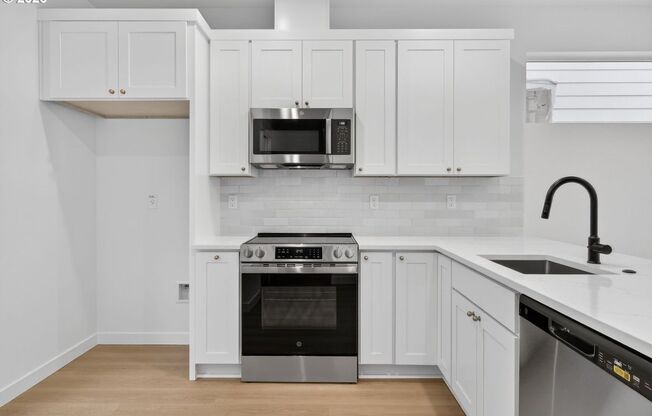 Brand-New 2-Bedroom Home with White Granite Kitchen, Open-Concept Living & Attached Garage