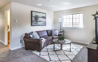 a living room with a couch and a coffee table  at Quail Springs, Washington