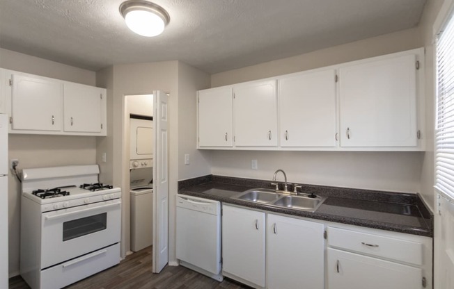 This is a photo of the kitchen of the 1004 square foot, 2 bedroom/1 bath Townhome with stackable washer/dryer floor plan at Colonial Ridge Apartments in the Pleasant Ridge neighborhood of Cincinnati, OH.