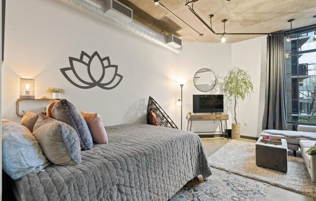 **FURNISHED** Streetcar Lofts studio w/parking/storage/Juliette balcony/fitness center/courtyard garden