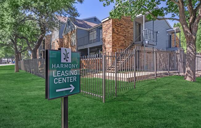 a sign on a lush green field