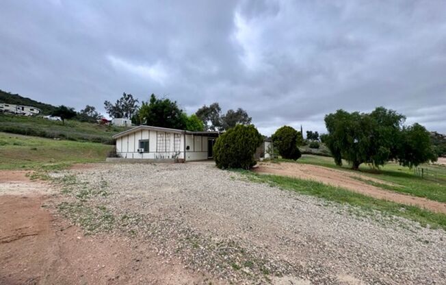 2 bedroom 2 bathroom ranch style single story home for LEASE with horse stables on site!