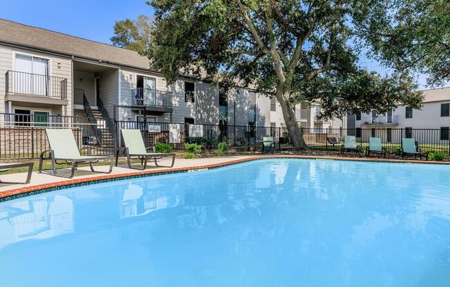 a large pool of water in front of a house