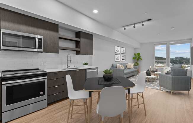 a kitchen and living room with a table and chairs