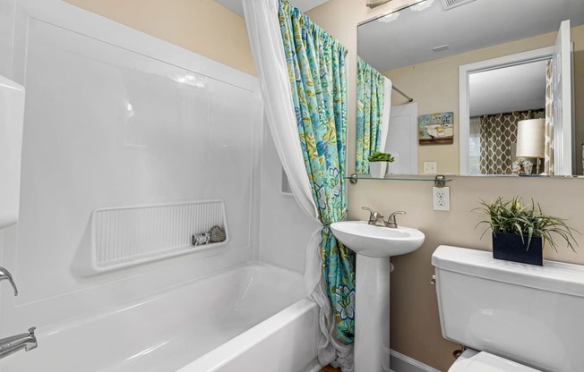 a bathroom with a sink toilet and bathtub