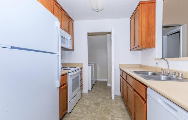 a kitchen with a sink and a refrigerator