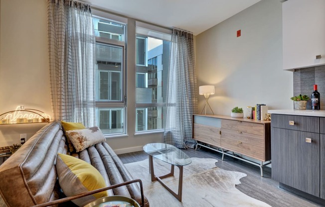 a living room with a couch and a large window at L Seven, San Francisco