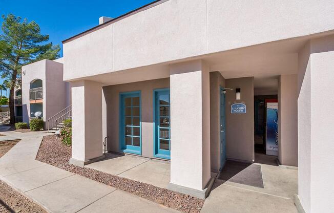 A building with a blue door and a sign that says