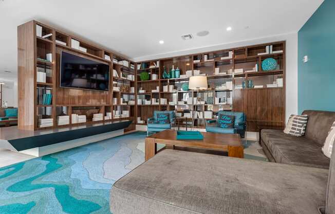 a living room with a couch and a coffee table and a television