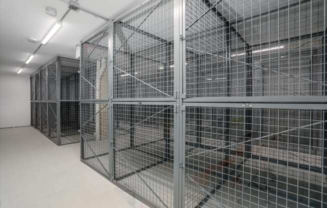 the inside of a prison cell with metal cages