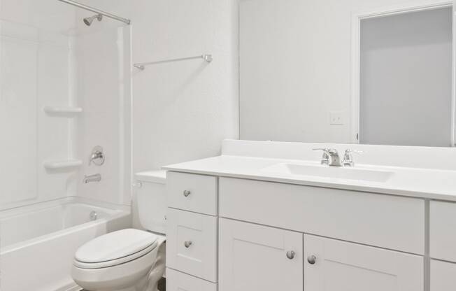 a bathroom with a sink toilet and bathtub