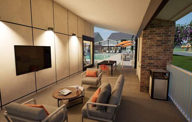 A patio with a couch, chairs, and a television.