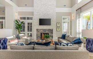 a living room filled with furniture and a fire place