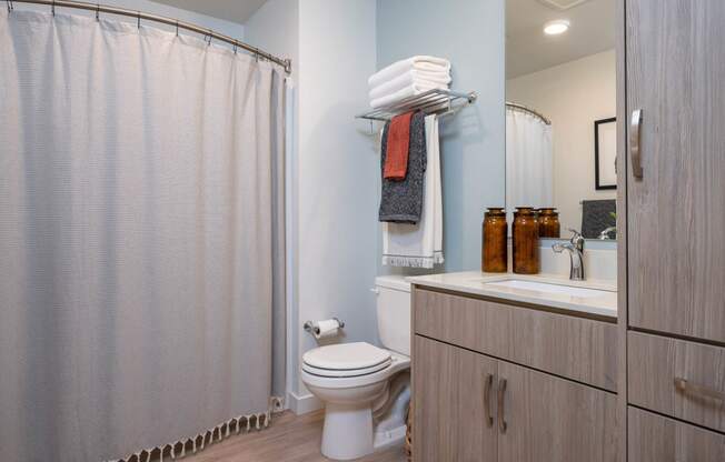 The Byway | Model #105 Bathroom Boasts Plenty of Storage and Curved Shower Rod