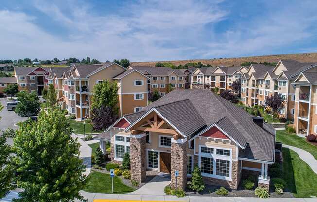 an aerial view of an apartment complex with trees and buildings at Quail Springs, West Richland, WA