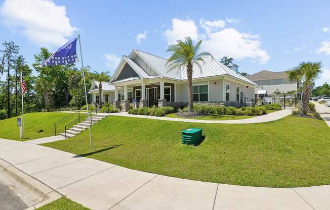 The front of the leasing office with Westdale flag at Capital Grand Apartments in Tallahassee, FL