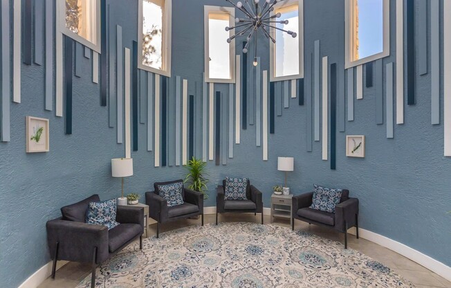 Experience the elegance of Distinction Apartment Homes, featuring a stunning lounge with modern decor and vibrant natural light. Enjoy a space designed for relaxation and connection. Explore your new home today!