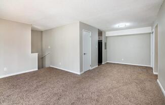 an empty room with a carpet and walls at Cleo Apartments, Alabama, 35611