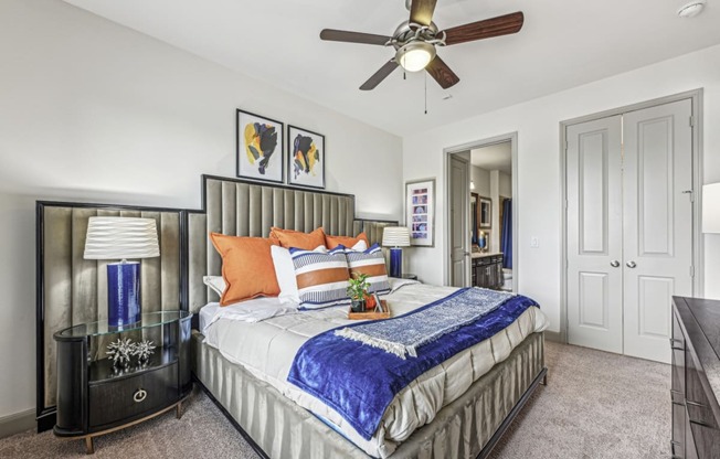 Well-decorated bedroom with comfortable bedding and stylish furnishings at Allusion at West University apartments in Houston, TX