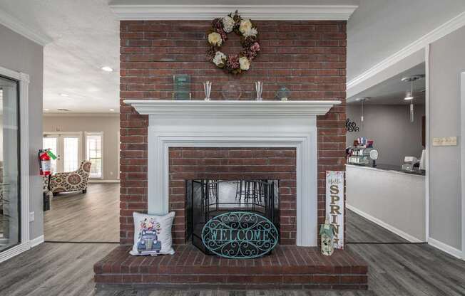 A fireplace with a sign that says "Spring" on it.