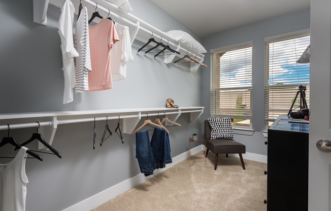 Large walk in closet with windows