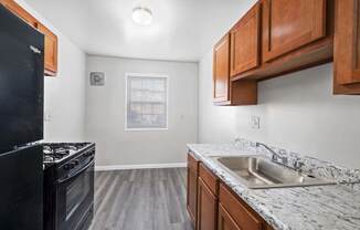 our apartments offer a kitchen with a sink and a stove