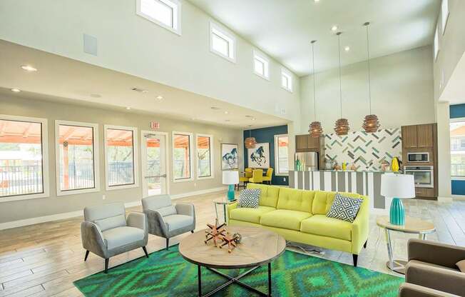 A living room with a yellow couch and a coffee table.