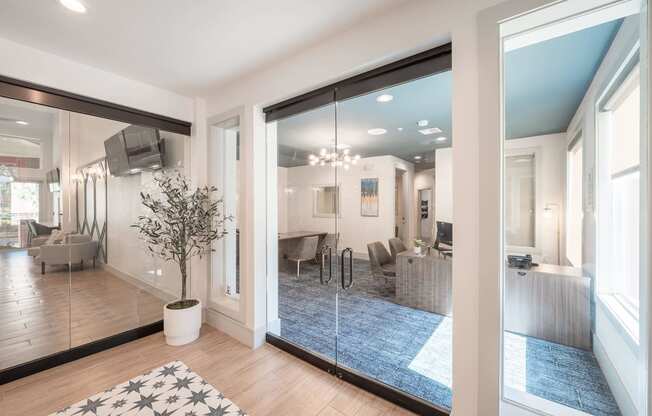 a living room with a large mirror and a rug