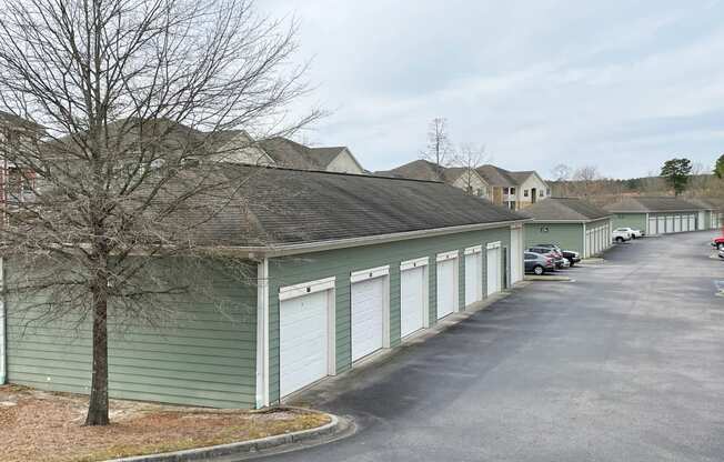 a row of garages on the side of a street
