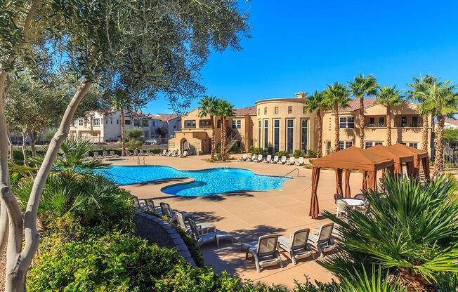 a pool next to a palm tree