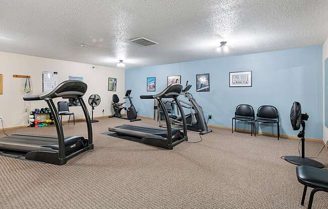 our gym has plenty of exercise equipment and chairs for residents to use